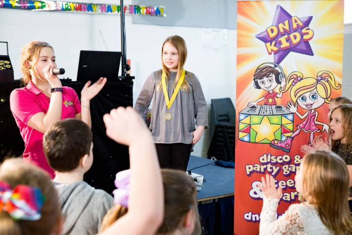 Birthday child being presented with medal