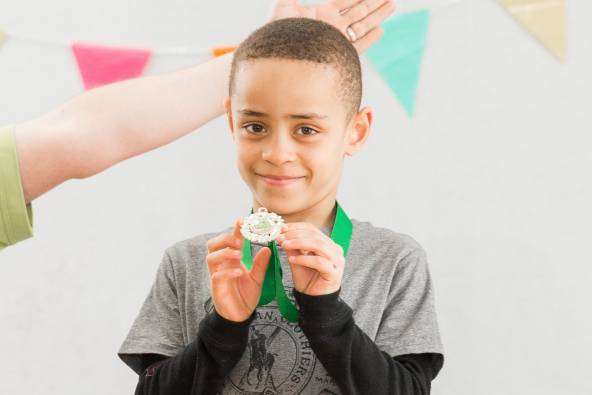 Birthday child with medal